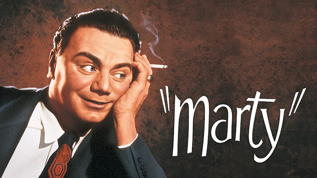 Ernest Borgnine wearing a suit and tie